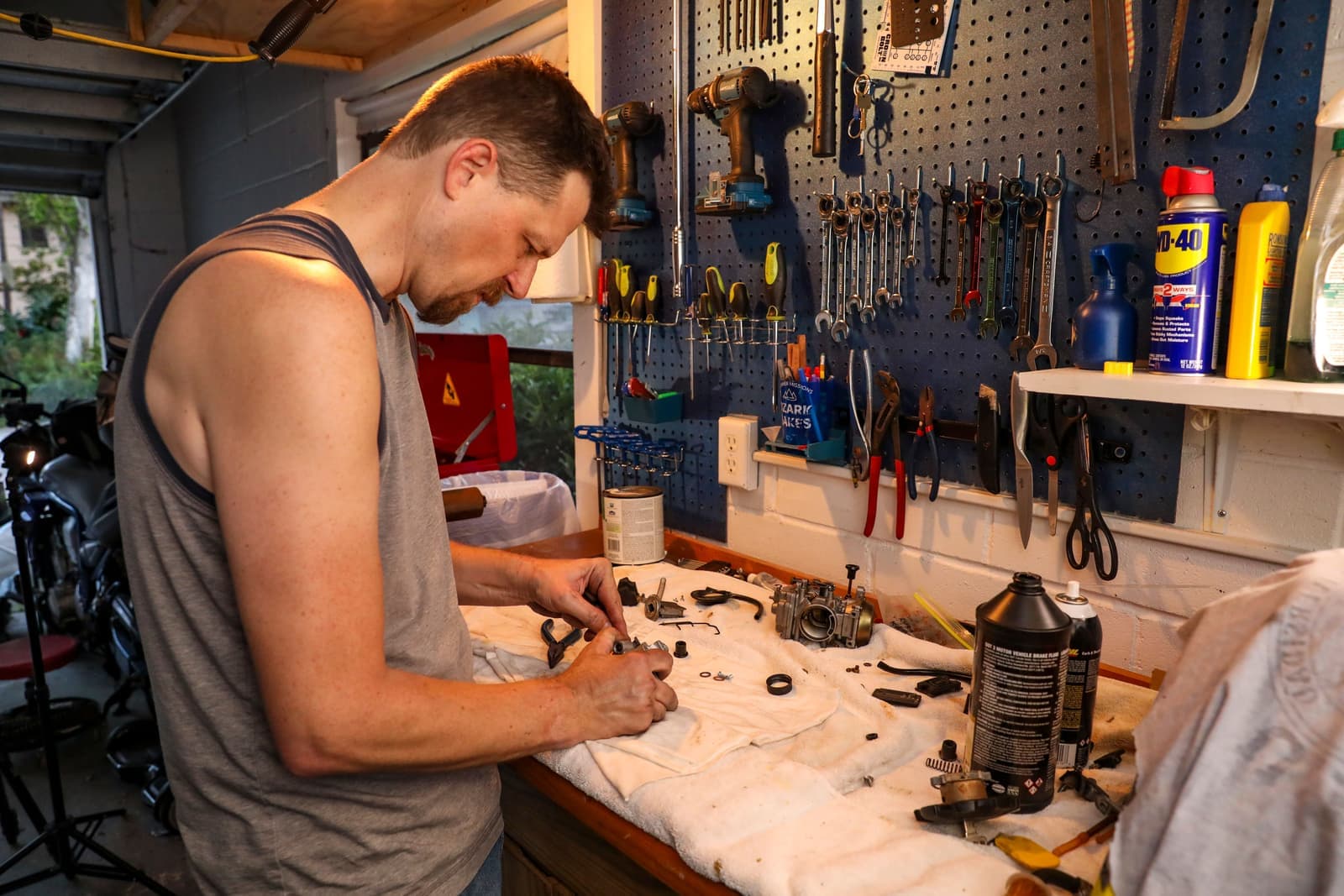 A watch movement partly disassembled on a repair bench