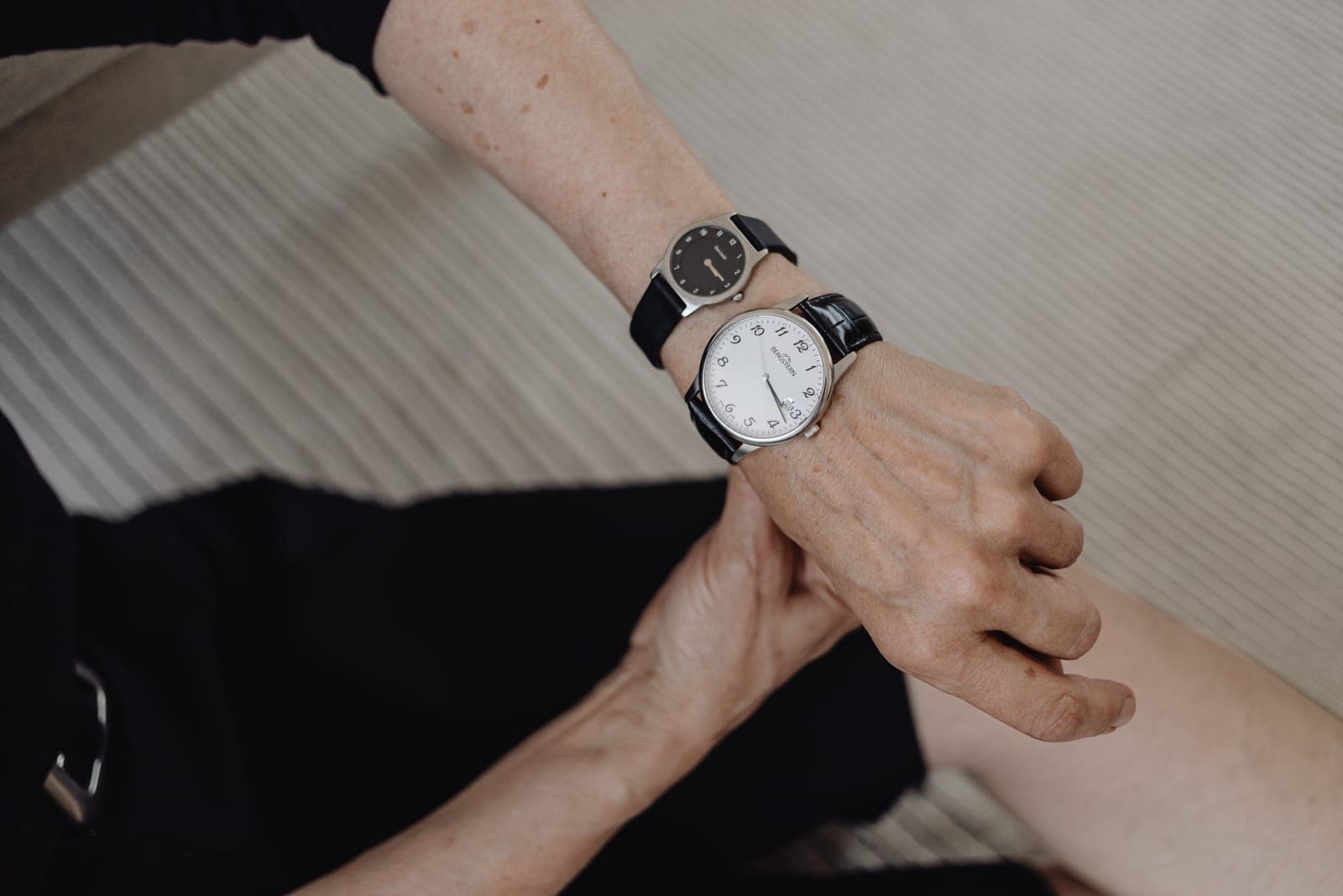 A small wristwatch worn on a slim wrist