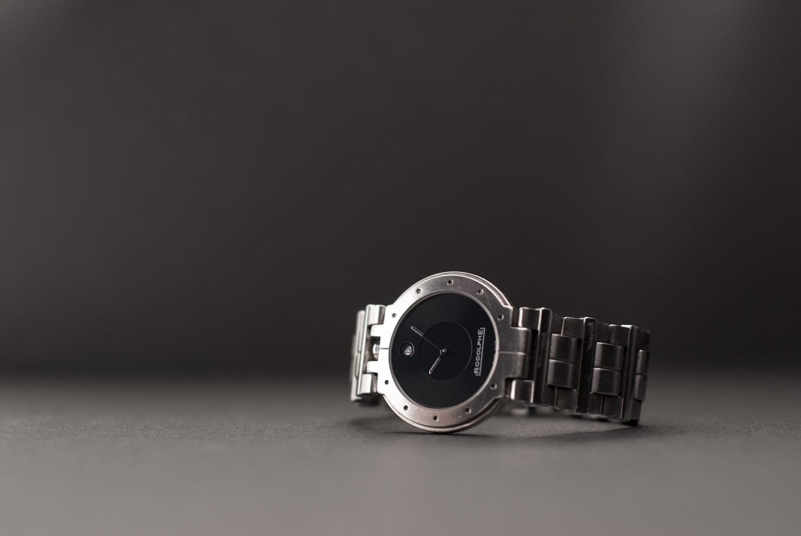 A steel bracelet and case photographed close up